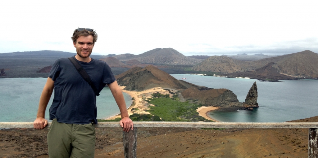 Your author at the highest point on Bartolome. Part of the video above was taken swimming around that pinnacle of lava to the right of this photo.